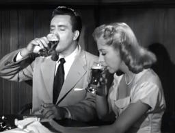 Capture from the film noir classic D.O.A., Frank Bigelow and Paula