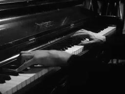 Screen capture from Detour (Edgar G. Ulmer, 1945): Al playing piano