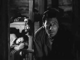 Screen capture from The Trollenberg Terror (The Crawling Eye): Peering into the cold darkness: Dewhurst and Brett; Dewhurst watches from the bottom bunk, Brett crouches at the cabin door