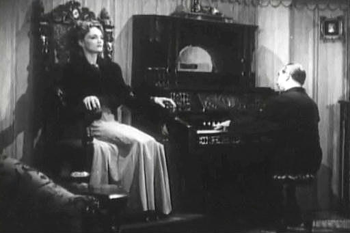 Capture from The Corpse Vanishes: Dr. George Lorenz (Bela Lugosi) and Countess Lorenz (Elizabeth Russell) in the Parlour