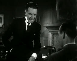 Capture from The House of Secrets (Roland D. Reed, 1936): Barry Wilding (Leslie Fenton) and Coventry (Jameson Thomas) in Coventry’s Office