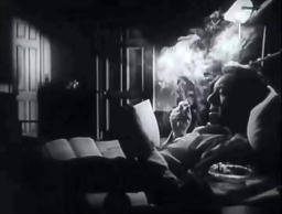Capture from The Scar (Hollow Triumph), John Muller (Paul Henreid) in bed, reading a book