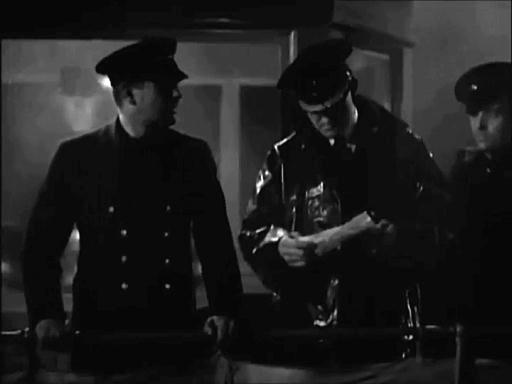 Capture from The Phantom Light (Michael Powell, 1935); Captain Pearce (Barry O'Neill), with mate and page, on deck reading message